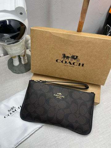 Coach Corner Zip Wristlet In Signature Canvas With Brown 101