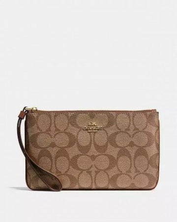 Coach Corner Zip Wristlet In Signature Canvas With Brown 102