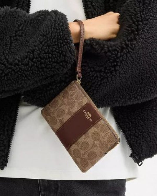Coach Corner Zip Wristlet In Signature Canvas With Brown Stripe