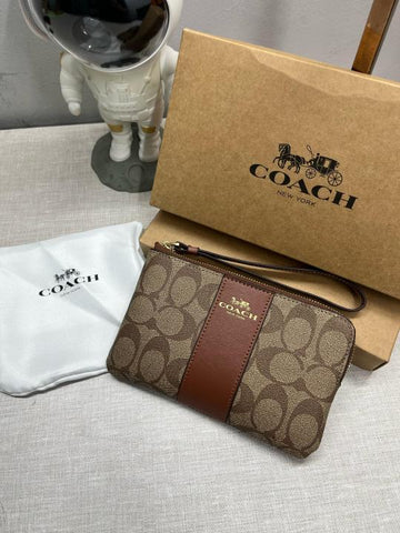 Coach Corner Zip Wristlet In Signature Canvas With Brown Stripe